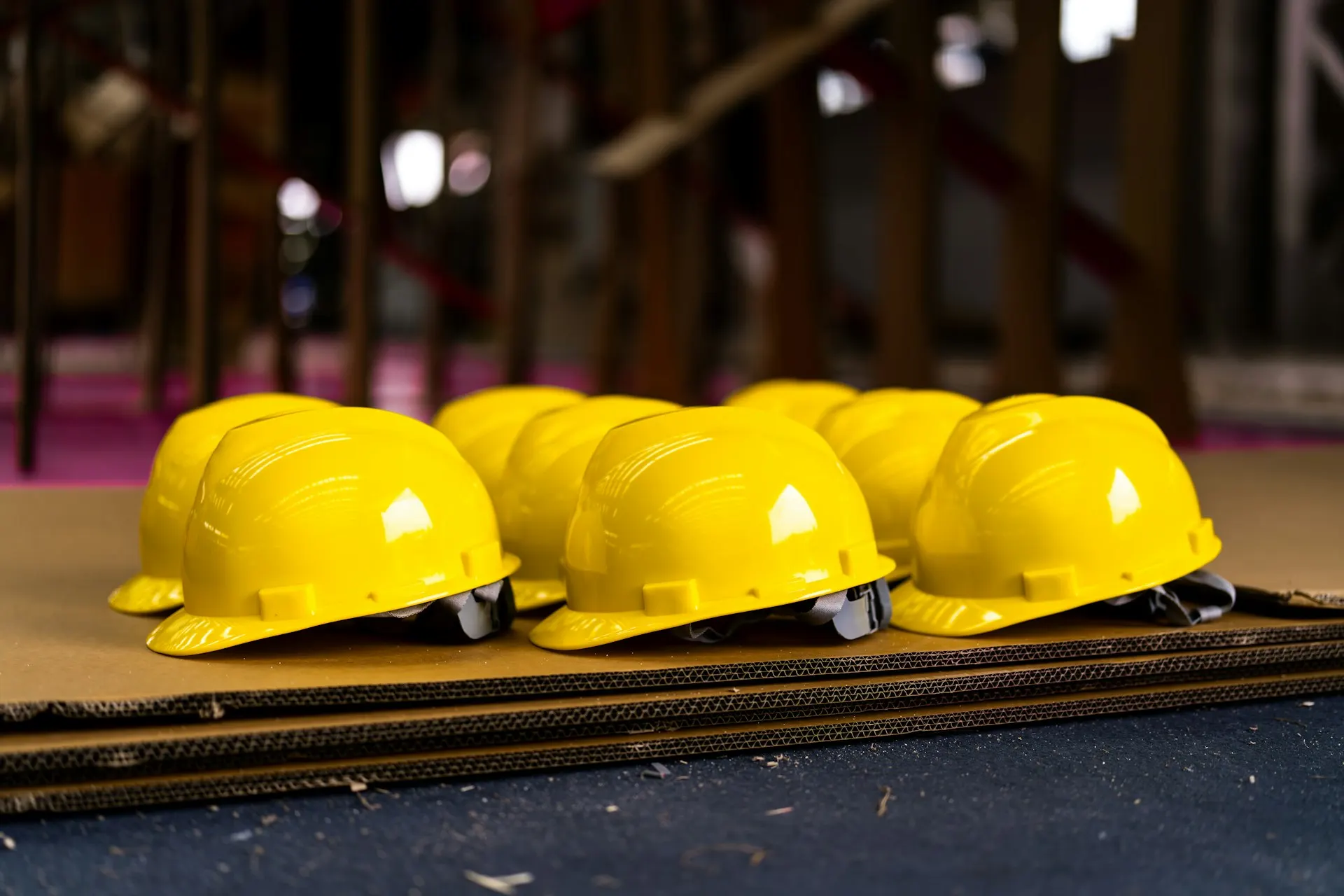 A row of yellow hard hats